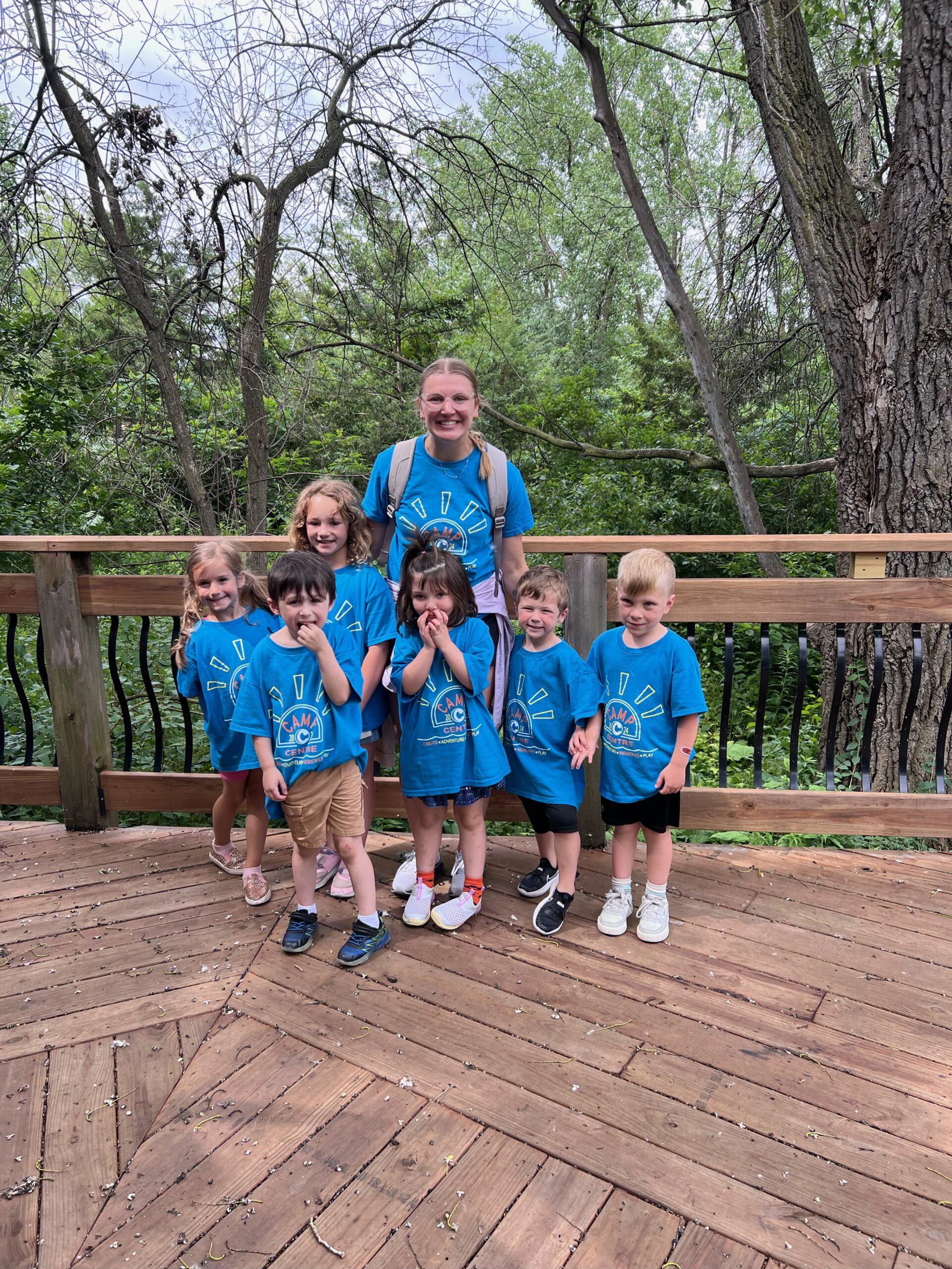 Child care teacher with six Camp Centre kids